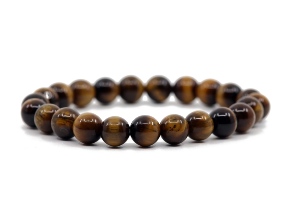 Tiger's eye gemstone bracelet in close-up view with polished beads and golden-brown grain