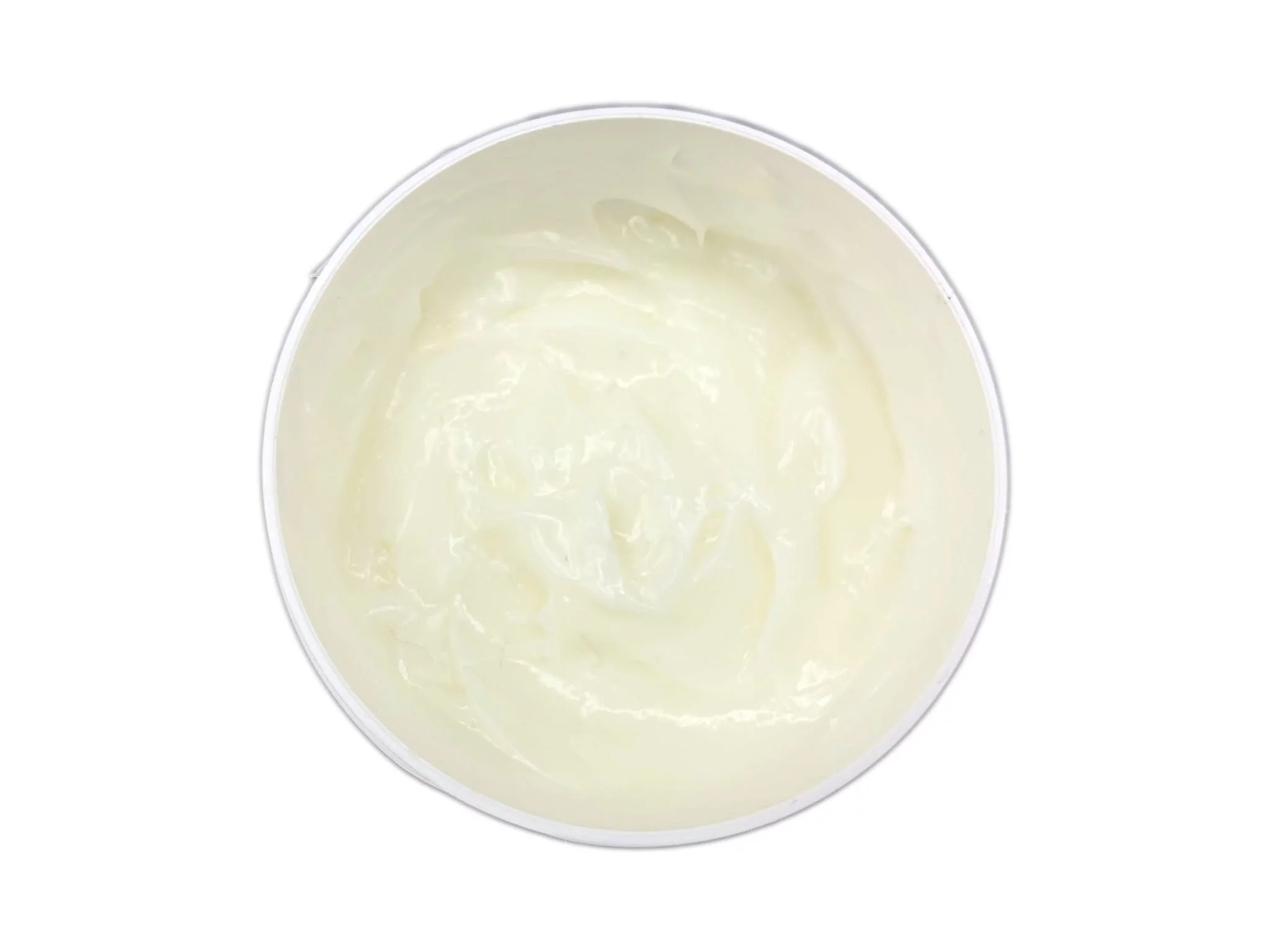 Crème de soin à l’herbe du tigre sous forme de crème brillante et jaunâtre dans un pot ouvert, vue de dessus
